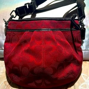 Coach Crossbody with Red C’s and brown adjustable strap.